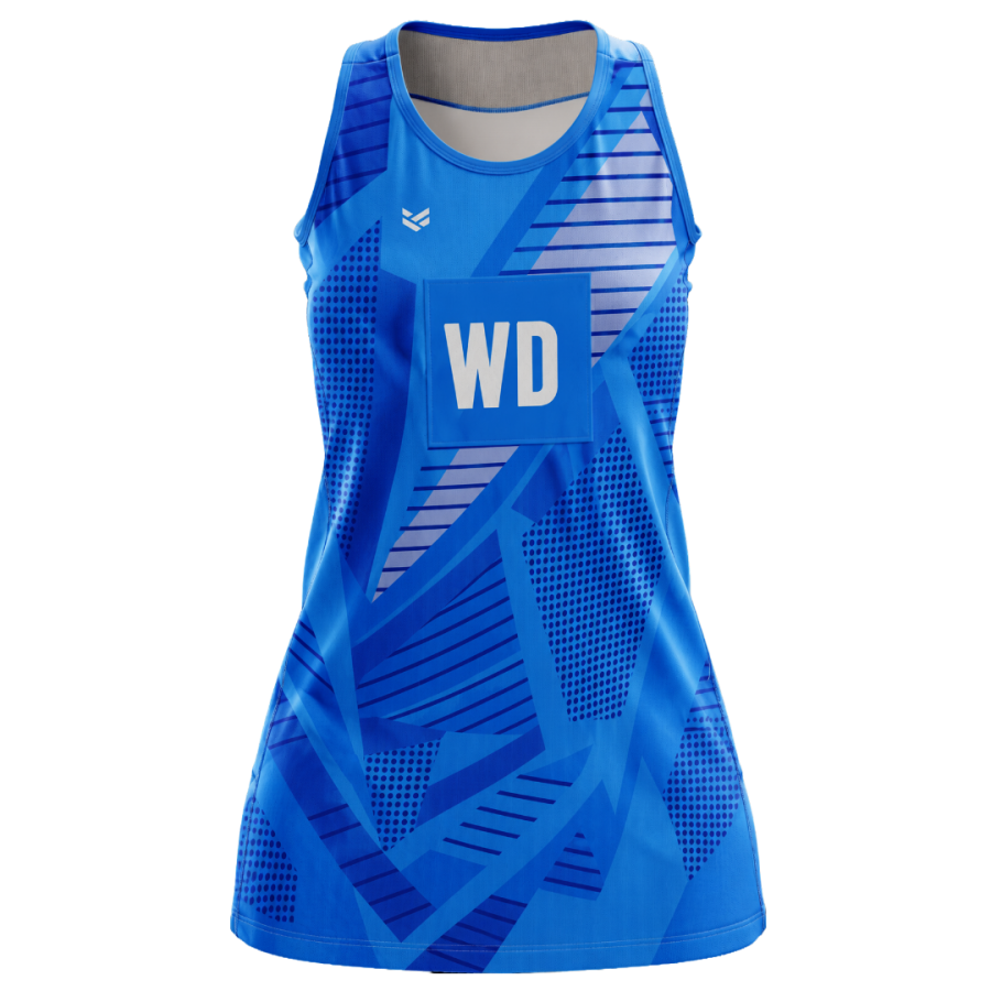 Bespoke netball dress with a blue geometric print, bib attachment panel and lightweight performance fabric for competitive play.