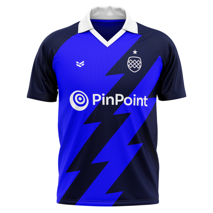 A bold navy lightning graphic cuts across this royal blue cricket shirt, finished with a white collar and large front sponsor logo.
